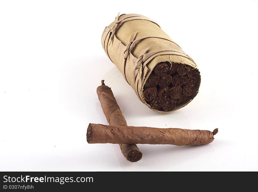 Two hand rolled cigars and a cuban humidor isolated on a white background