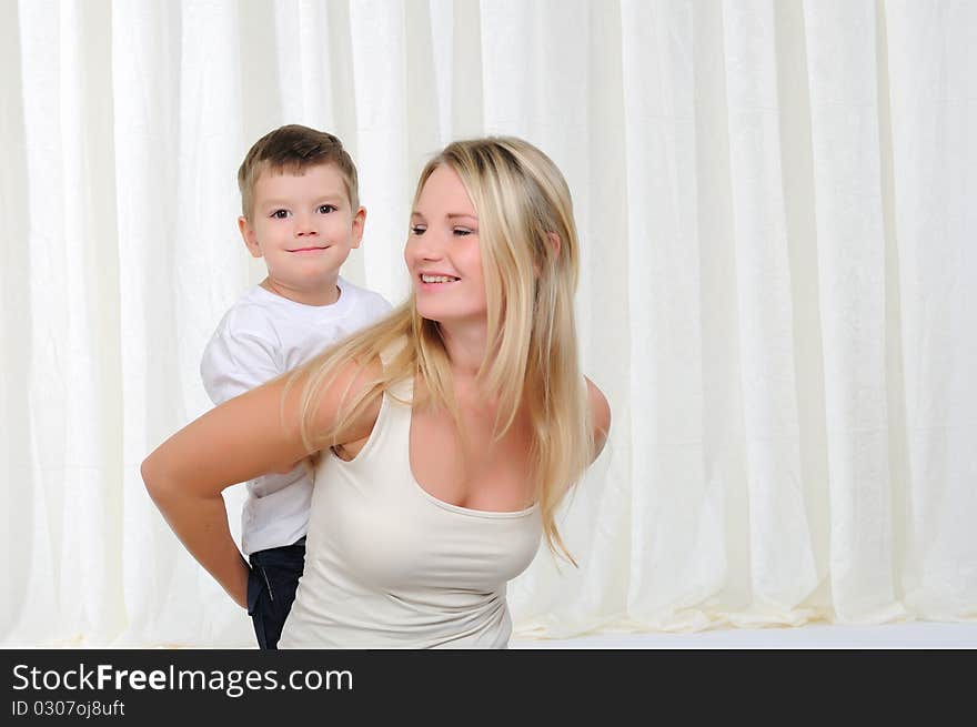 Young mother and son having fun together