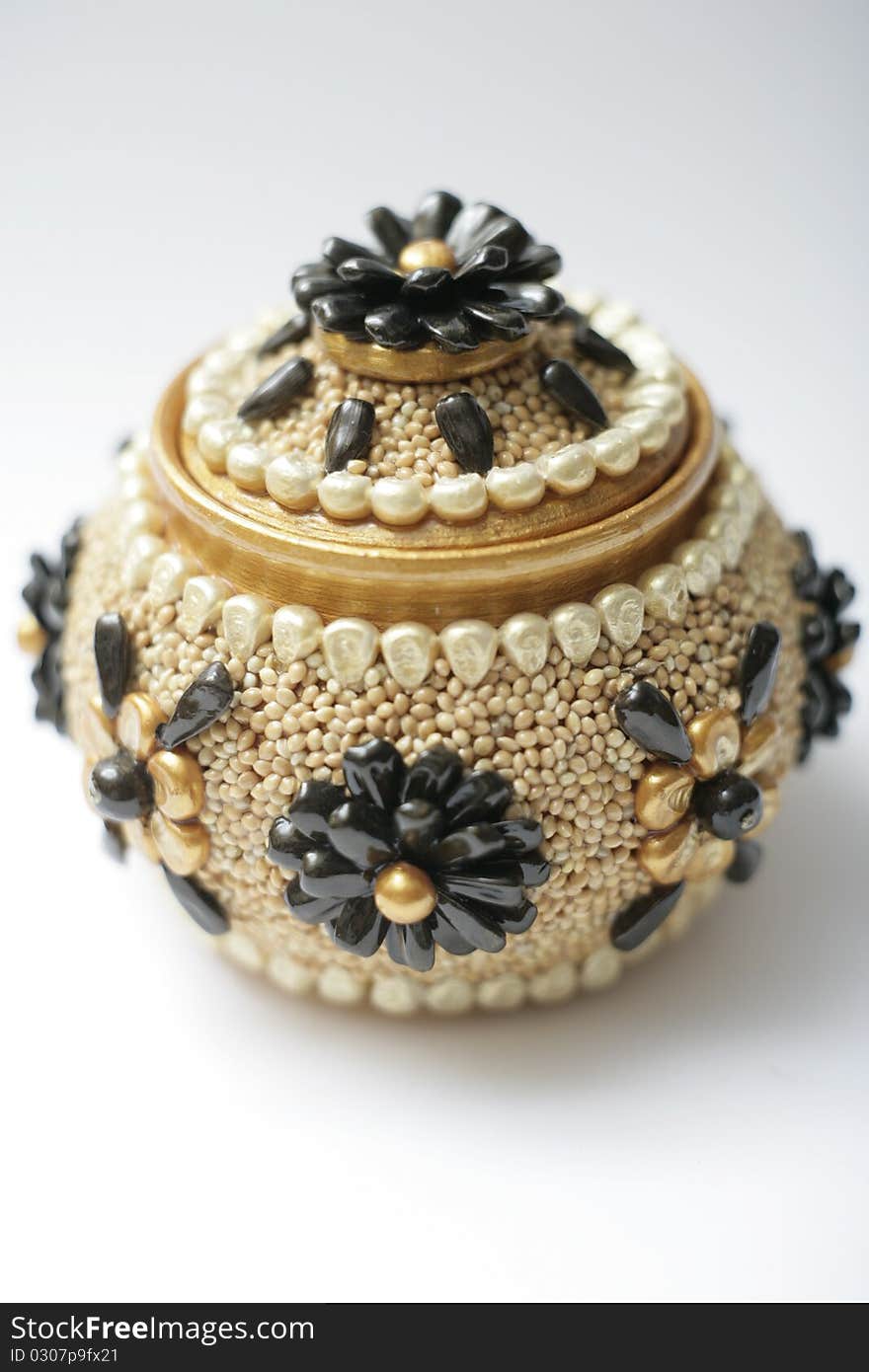 Pot decorated with seeds of plants. Pot decorated with seeds of plants