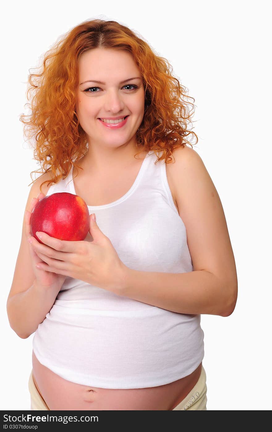 Young redhead pregnant mom thinks about healthy food