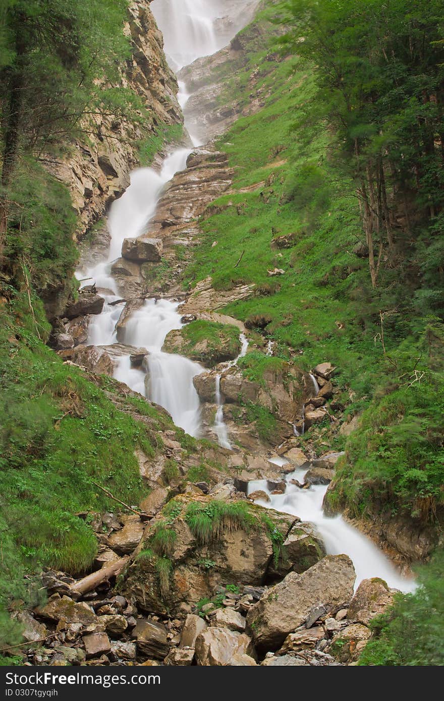 Waterfall in green nature in Switzerland