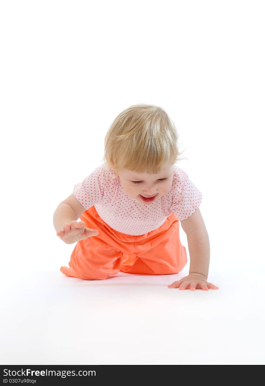 Studio portrait of baby running on all fours