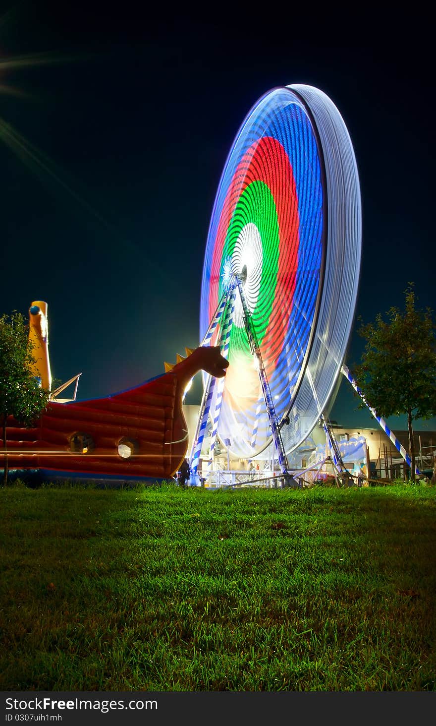 Carousels wheel at night in city