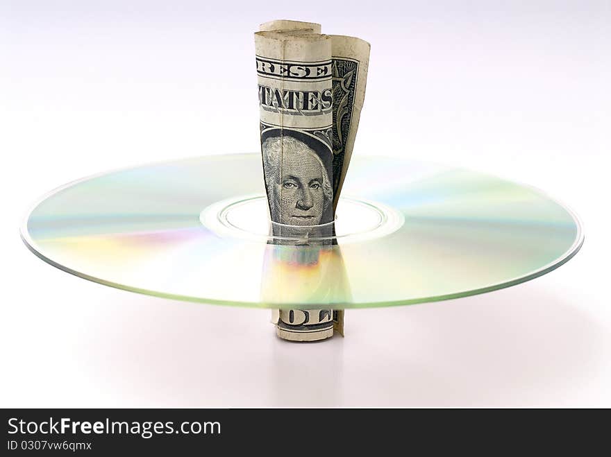 U.S. dollars rolled in the middle of a CD. U.S. dollars rolled in the middle of a CD