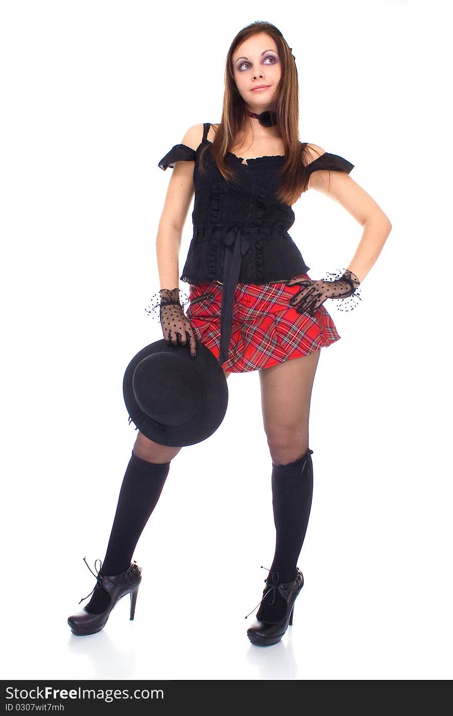 Gothic girl in mini skirt with hat on white background