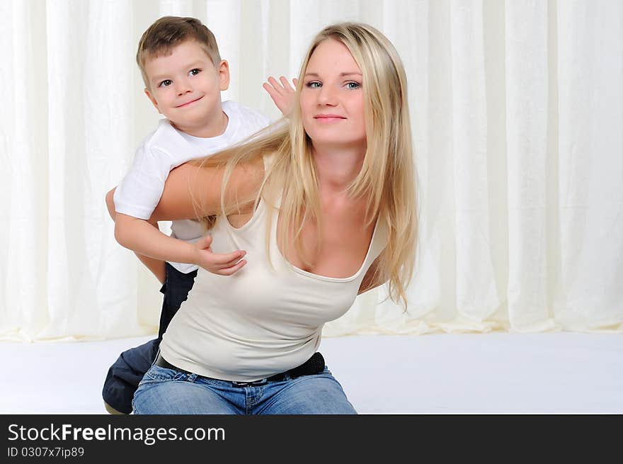 Young mother and son having fun together