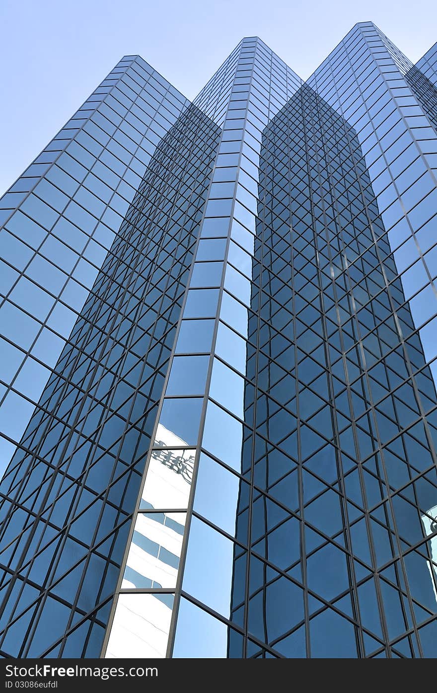 An upwards view of a modern skyscraper. An upwards view of a modern skyscraper