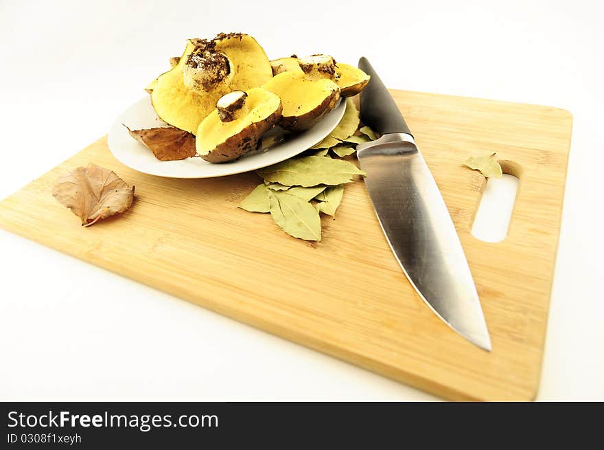 Plate of mushrooms on a kitchen board