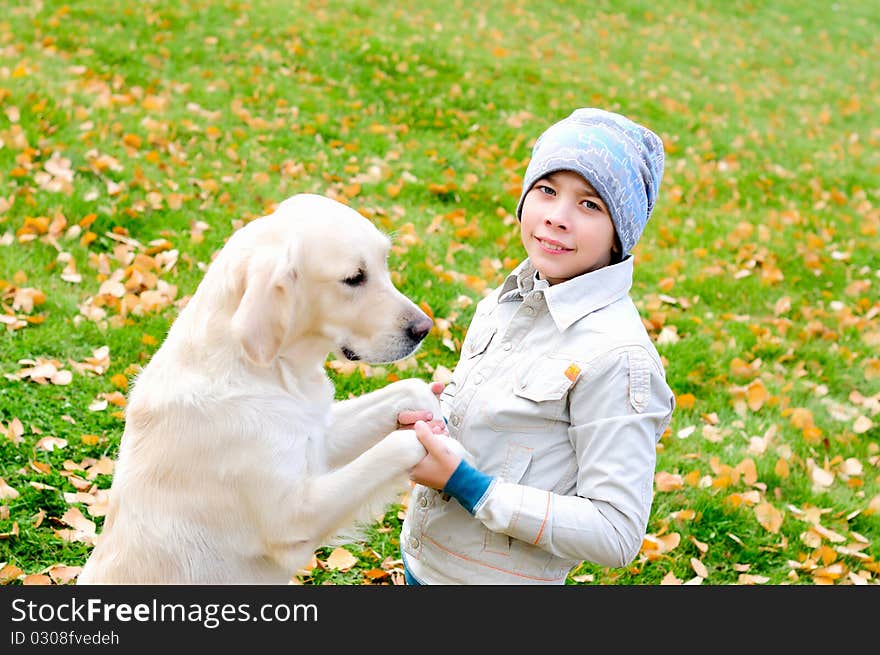 Boy playing in autumn park