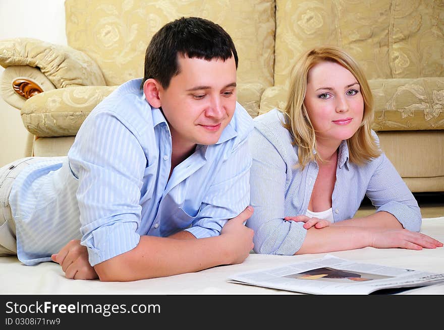 A young couple spends time together in the interior