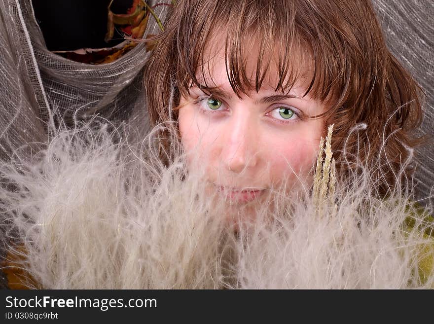 Beautiful girl and feather-grass