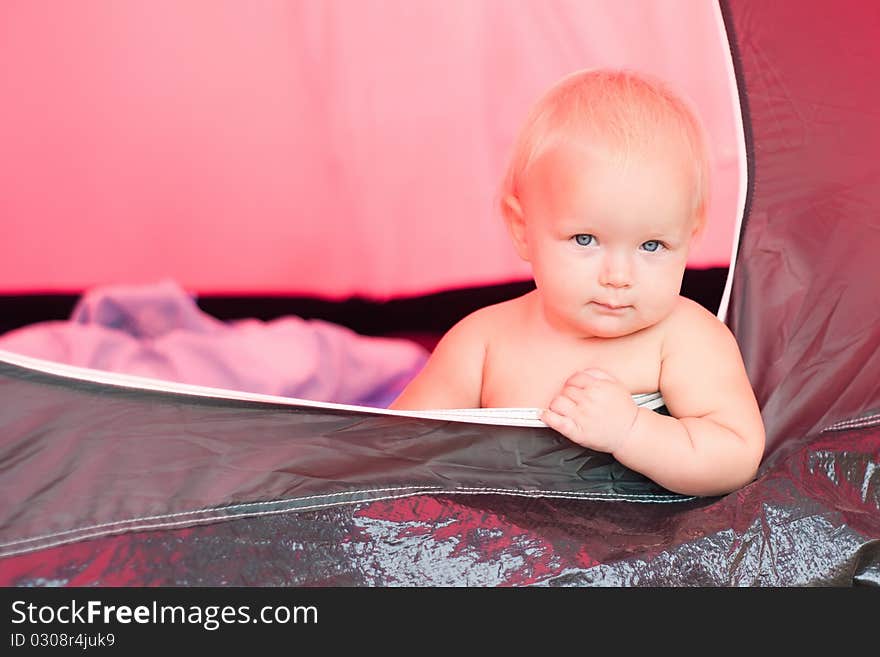 Baby sit near tent entrance