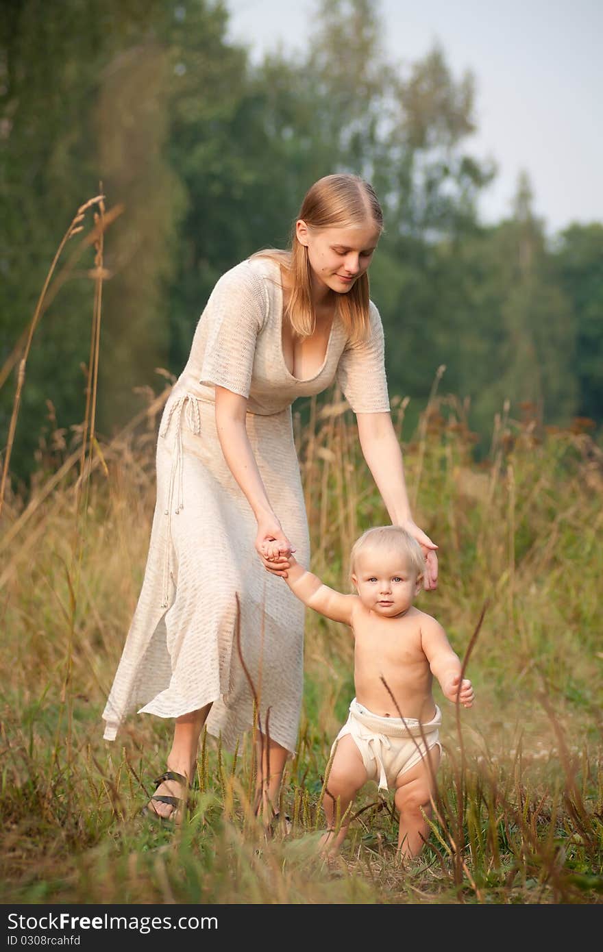 Mother Walk With Baby In Park