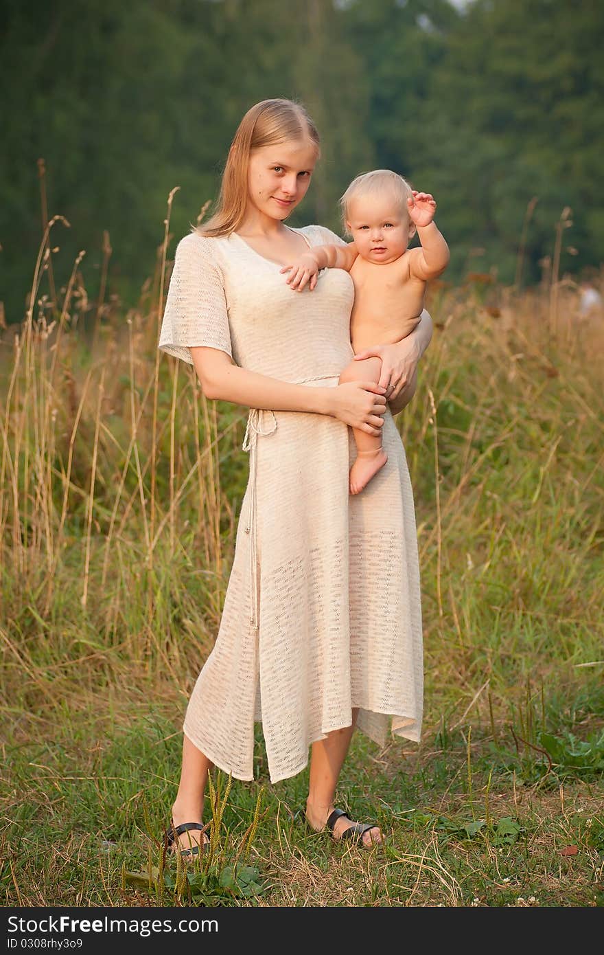 Mother holds smiling baby