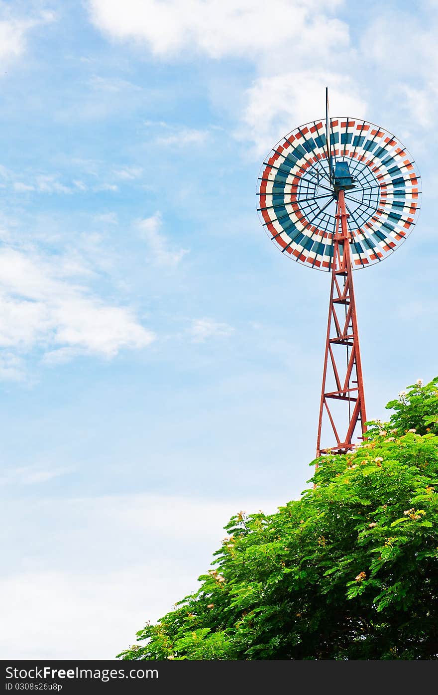 A windmill on clear sky.