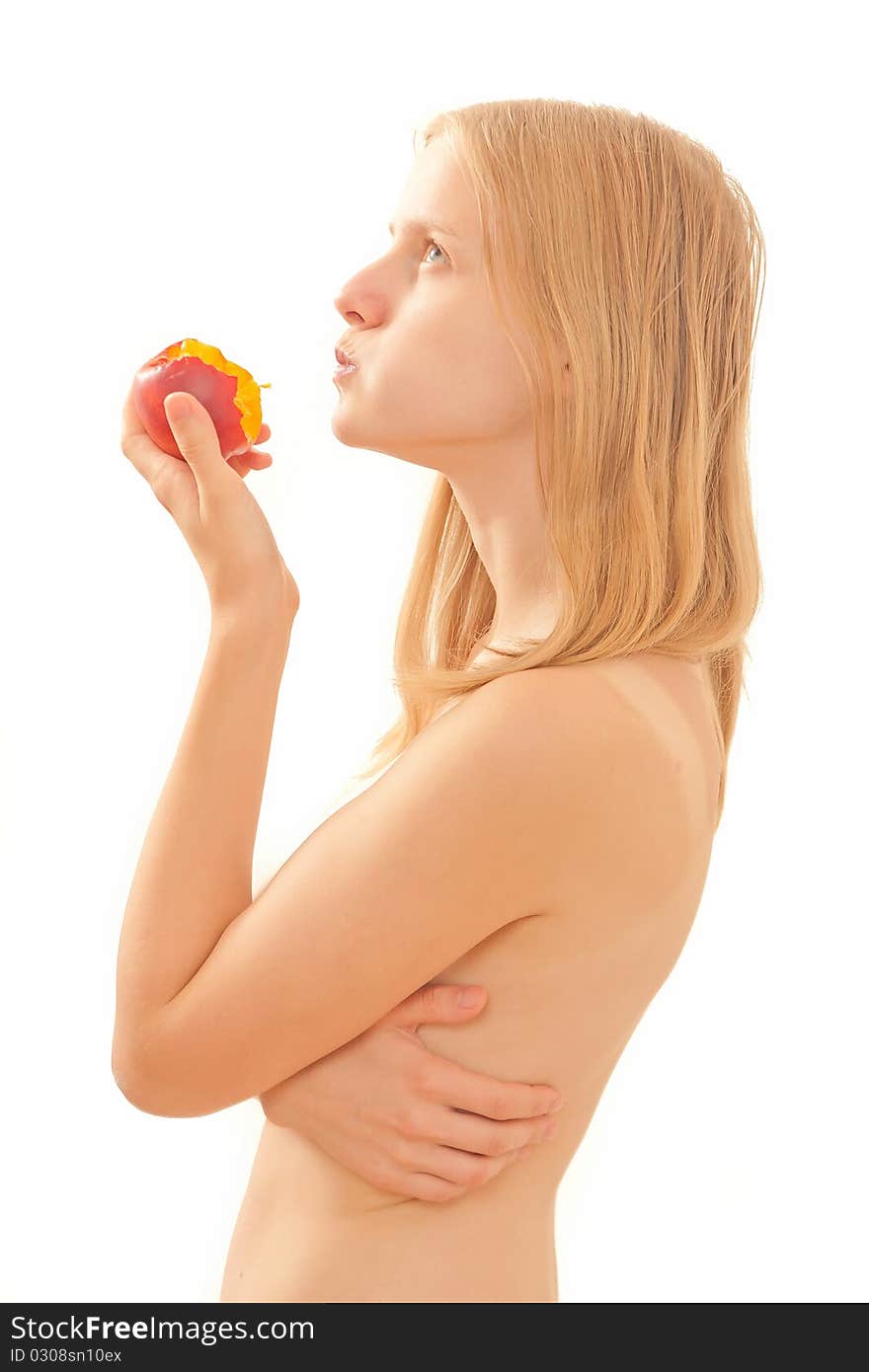 Beautiful young girl eating a peach on white.