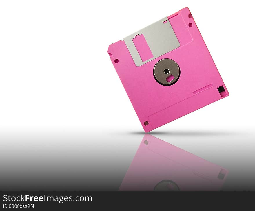 Back of Pink floppy disk on reflect white floor and background