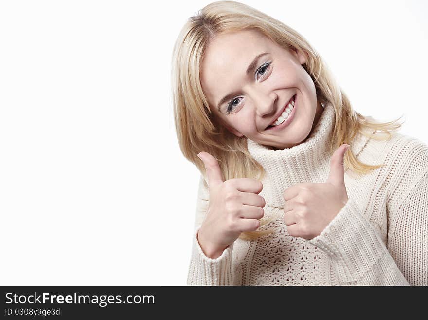 Attractive woman holds a thumbs up on a white background. Attractive woman holds a thumbs up on a white background