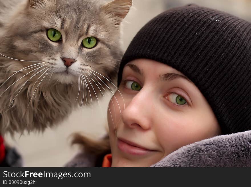 Wonderful girl and cat by a large plan