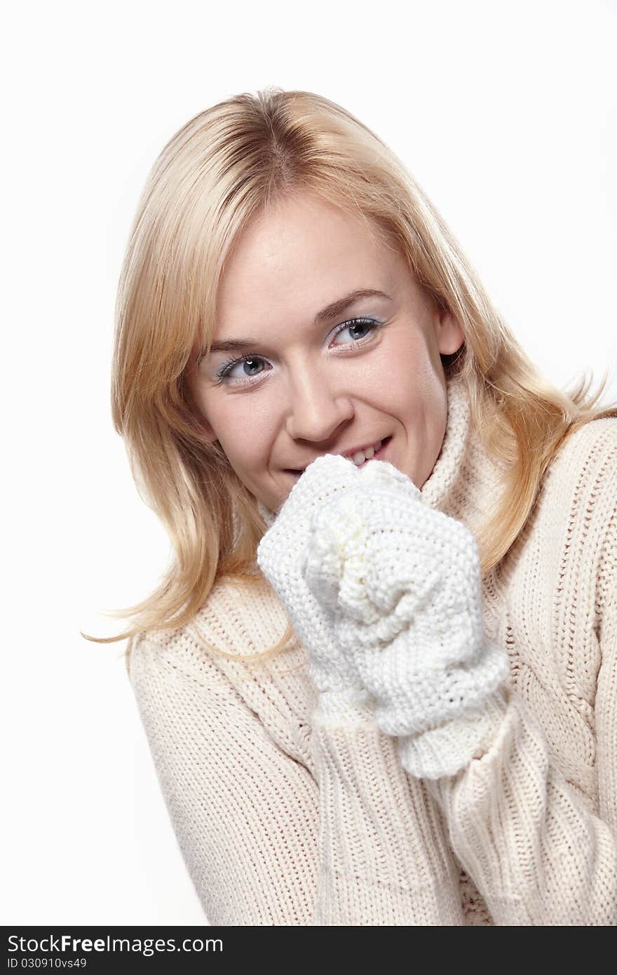 Attractive girl in a sweater and mittens. Attractive girl in a sweater and mittens