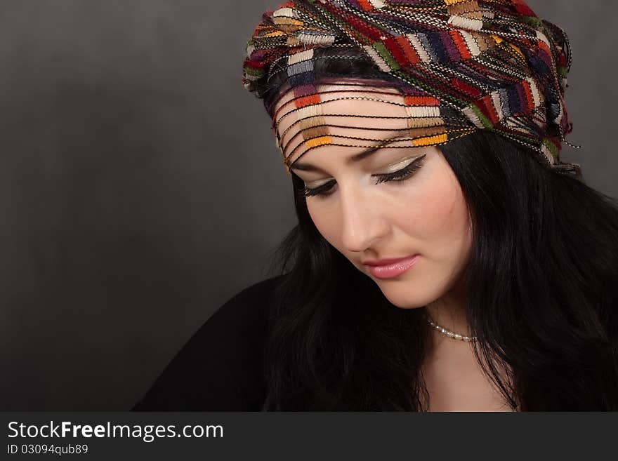 Portrait of beautiful girl in a shawl