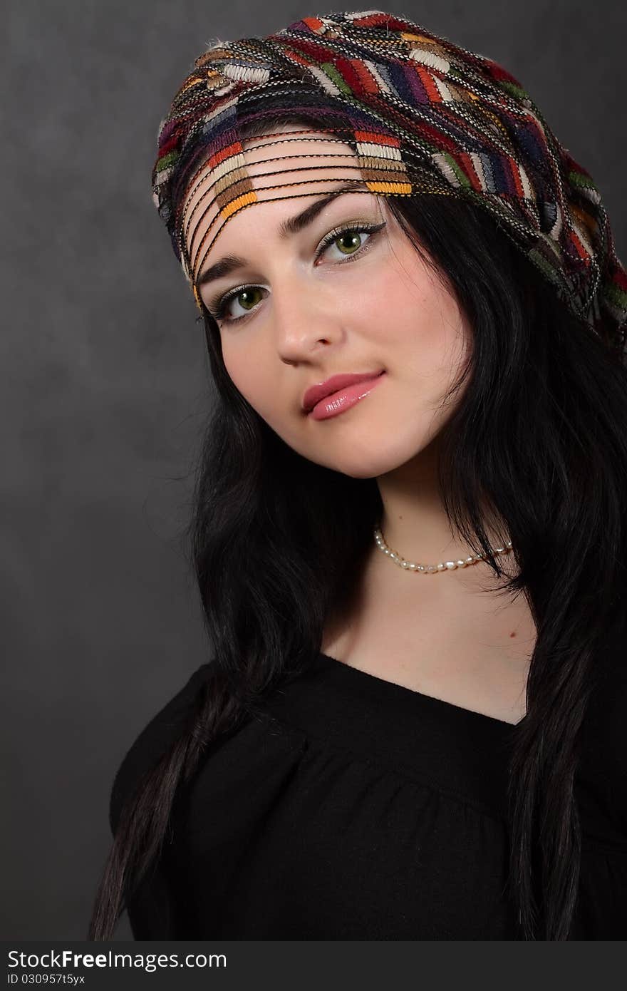 Portrait of beautiful girl in a shawl