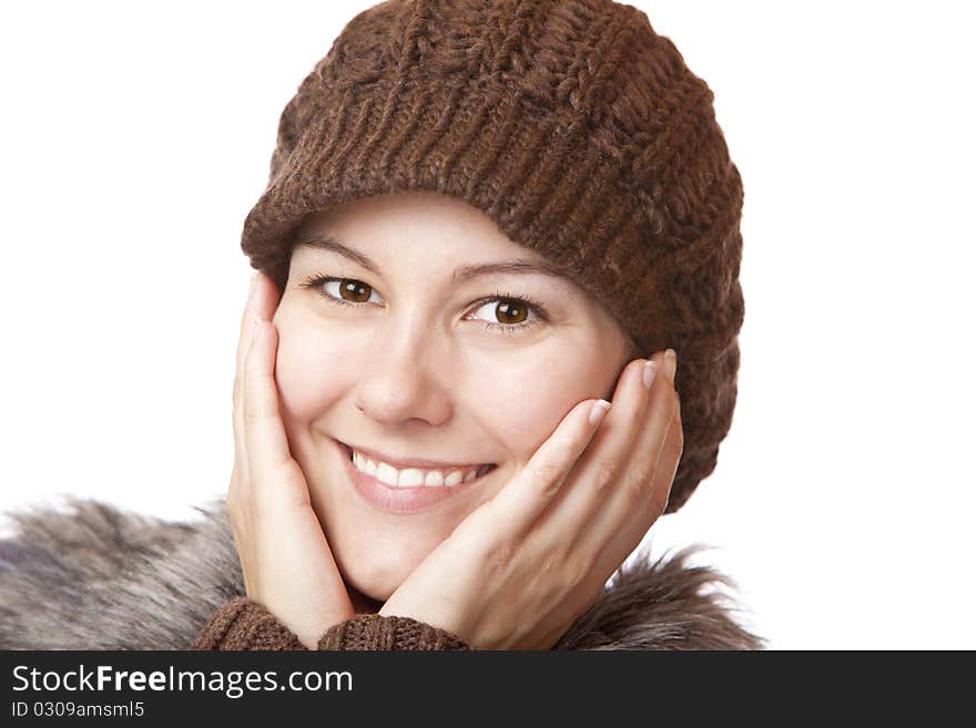 Beautiful woman with hands on face smiles happy. Isolated on white background. Beautiful woman with hands on face smiles happy. Isolated on white background.