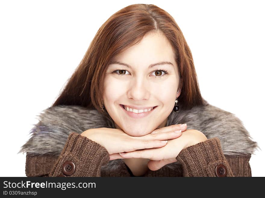 Young Woman with chin on hands smiling happy