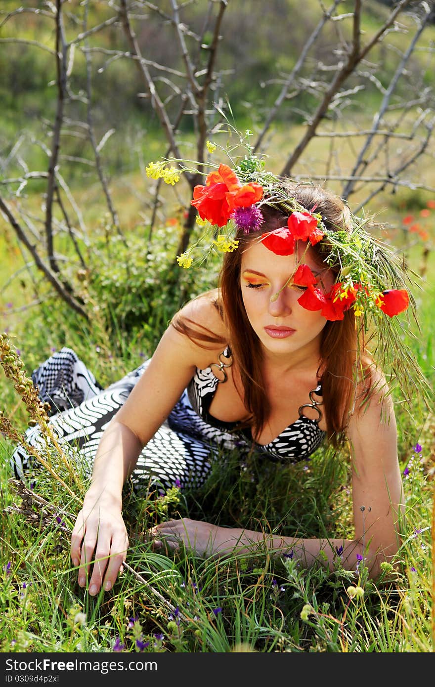 Woman and circlet of flowers