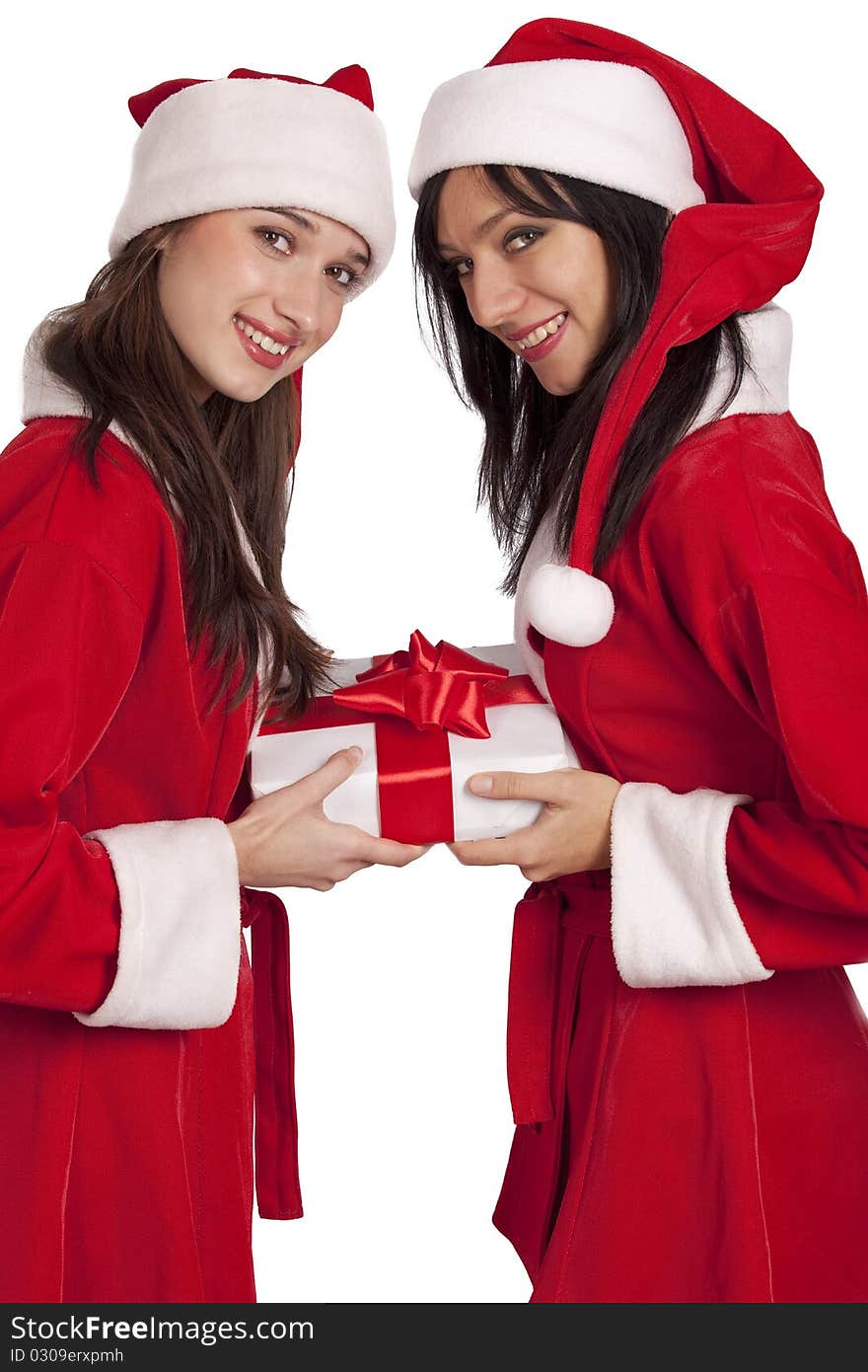 Young women in Santa costume with christmas gift isolated on white. Young women in Santa costume with christmas gift isolated on white