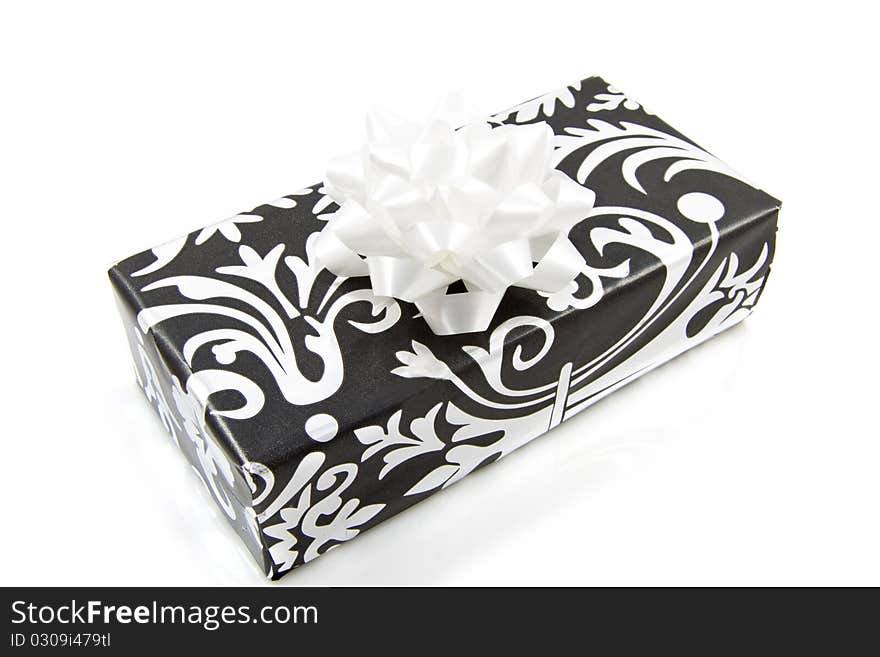 Black silver present with knot isolated over white. Black silver present with knot isolated over white