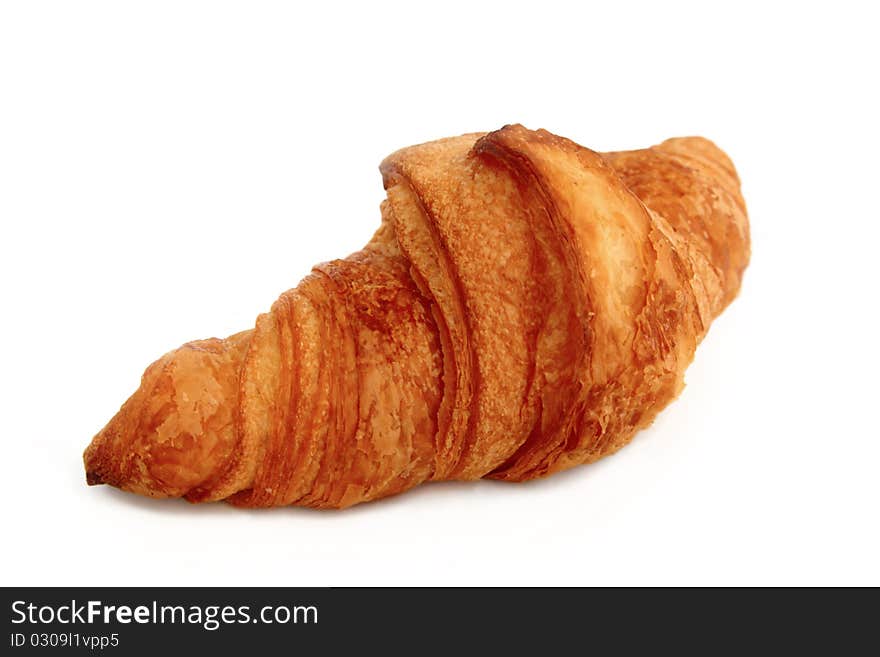 One croissant shot on white background. One croissant shot on white background.