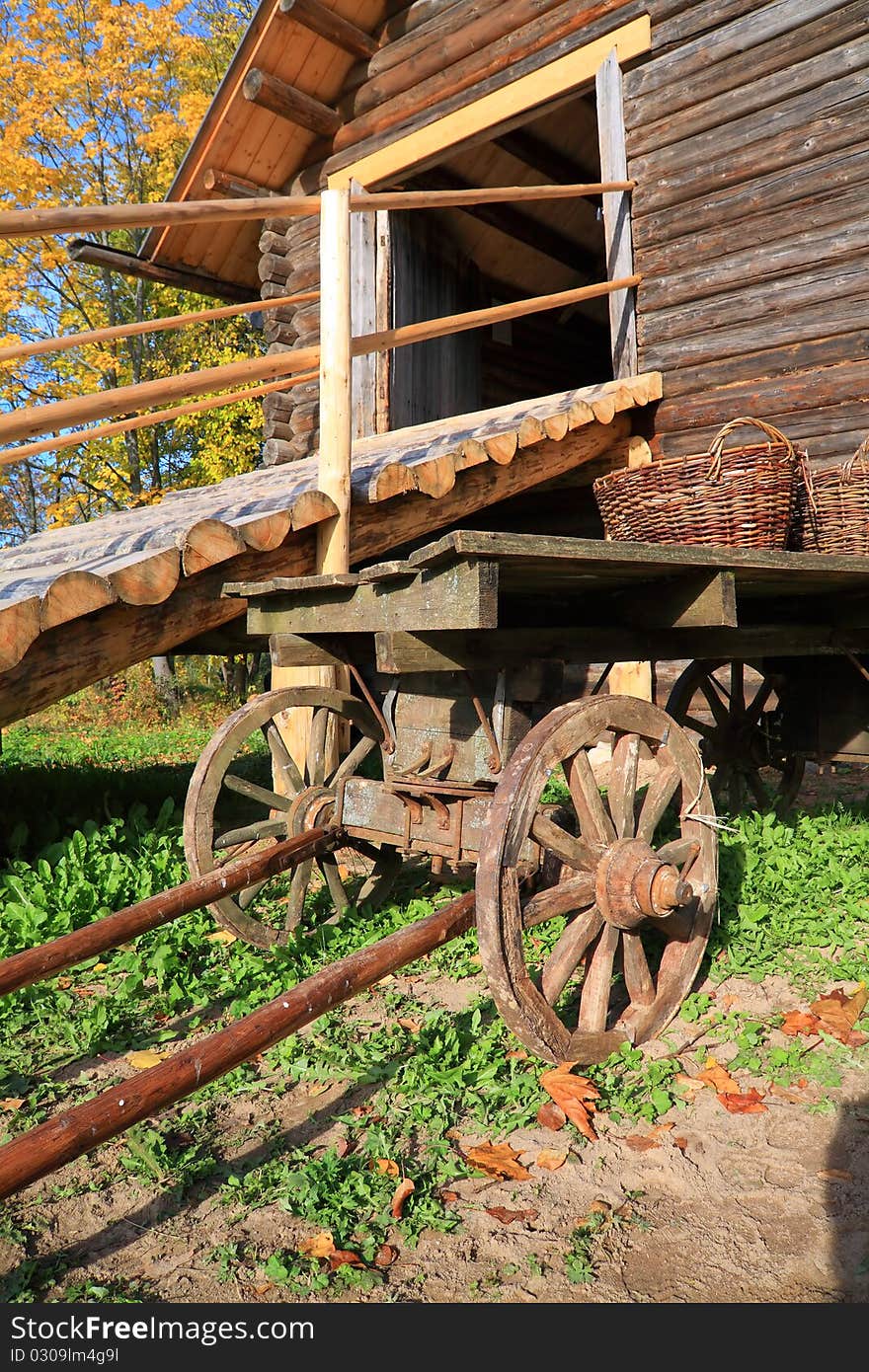 Aging cart near wooden barn