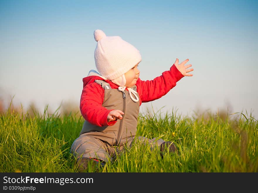 Adorable baby sit on top of hill