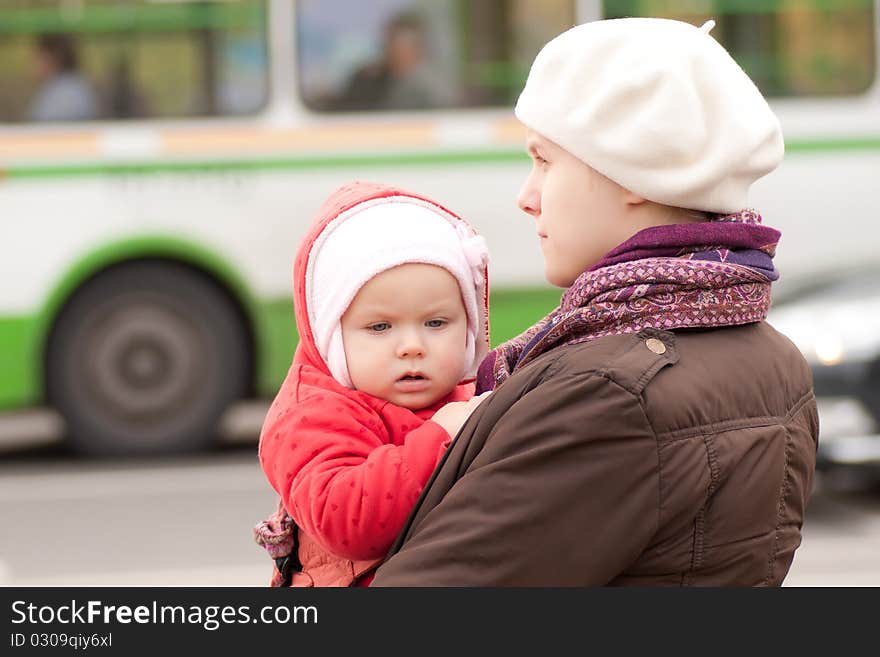 Adorable mother and daughter stay on crossroad