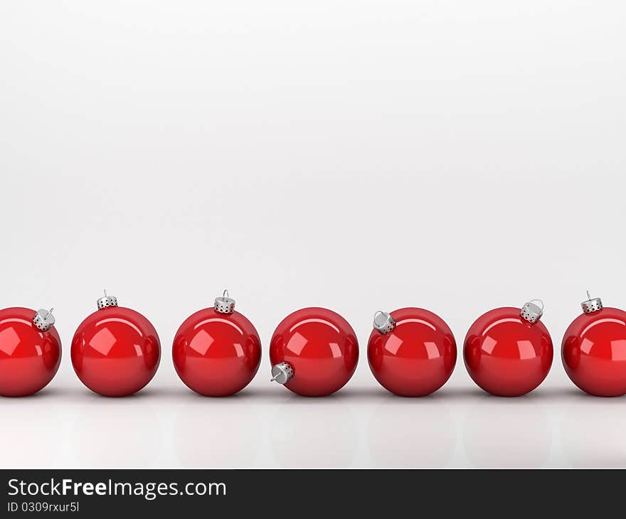 Red Christmas balls abreast on a white background