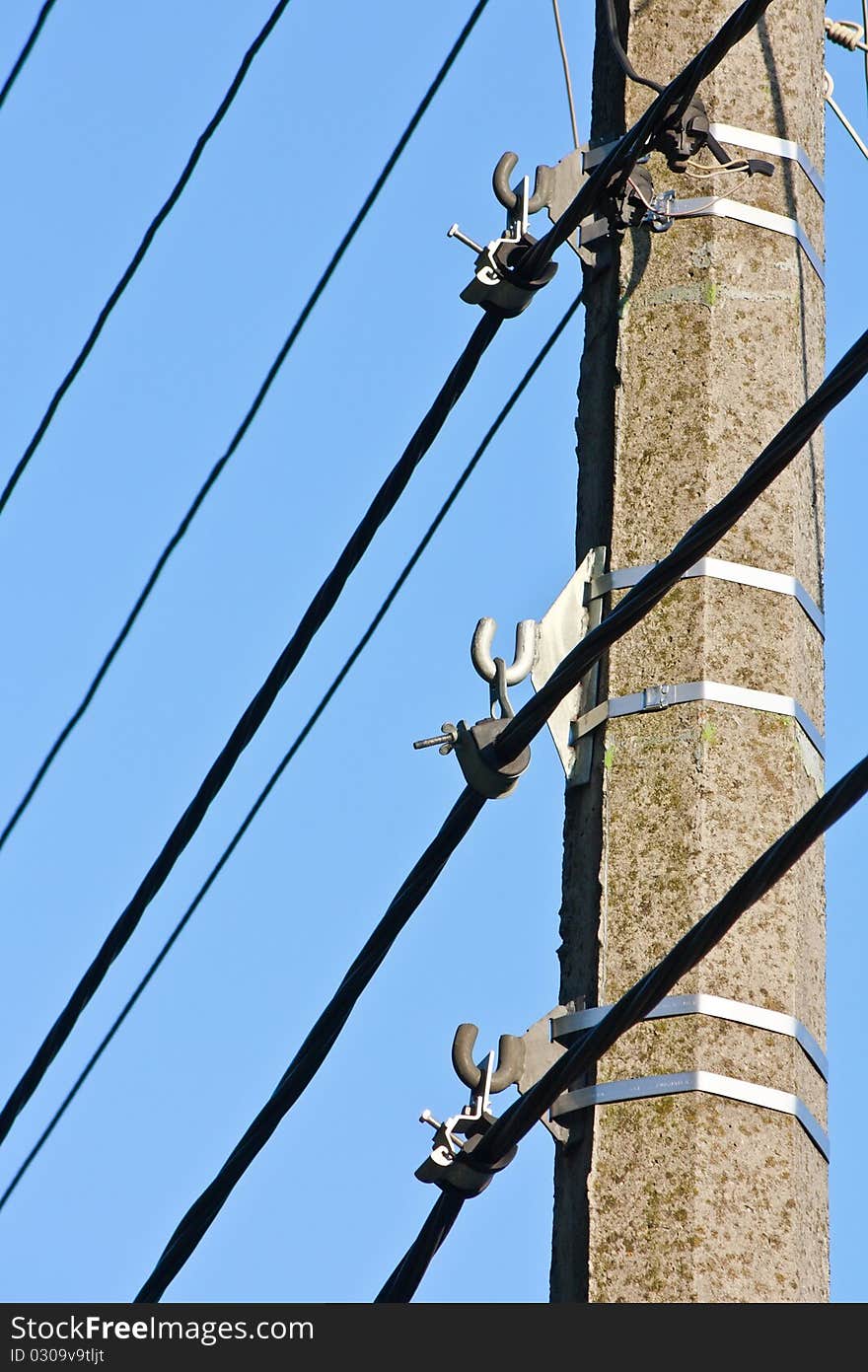 Pole with mountings, electric cables and wires. Pole with mountings, electric cables and wires