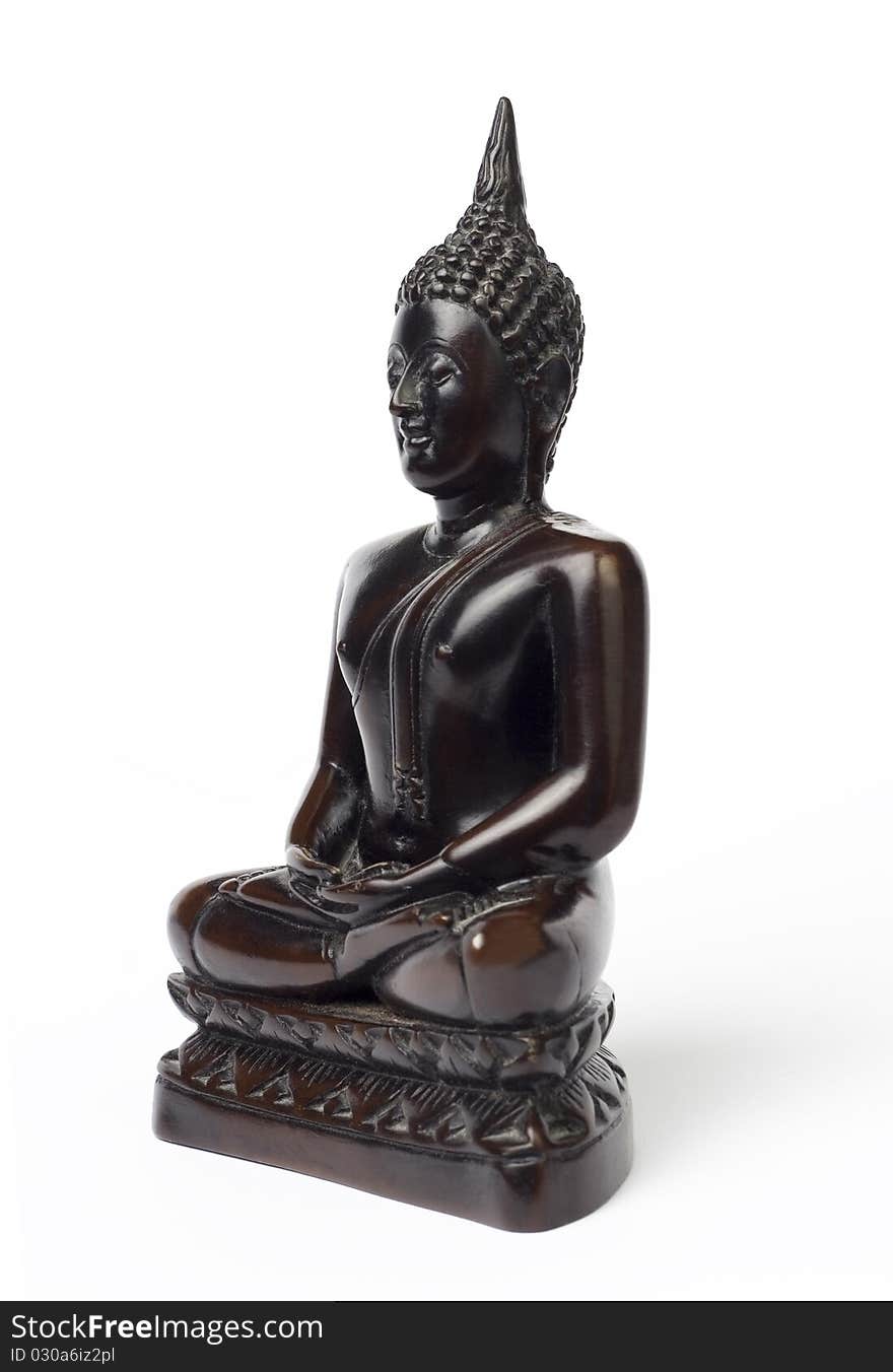 Dark brown wooden carved Buddha figure isolated on white.