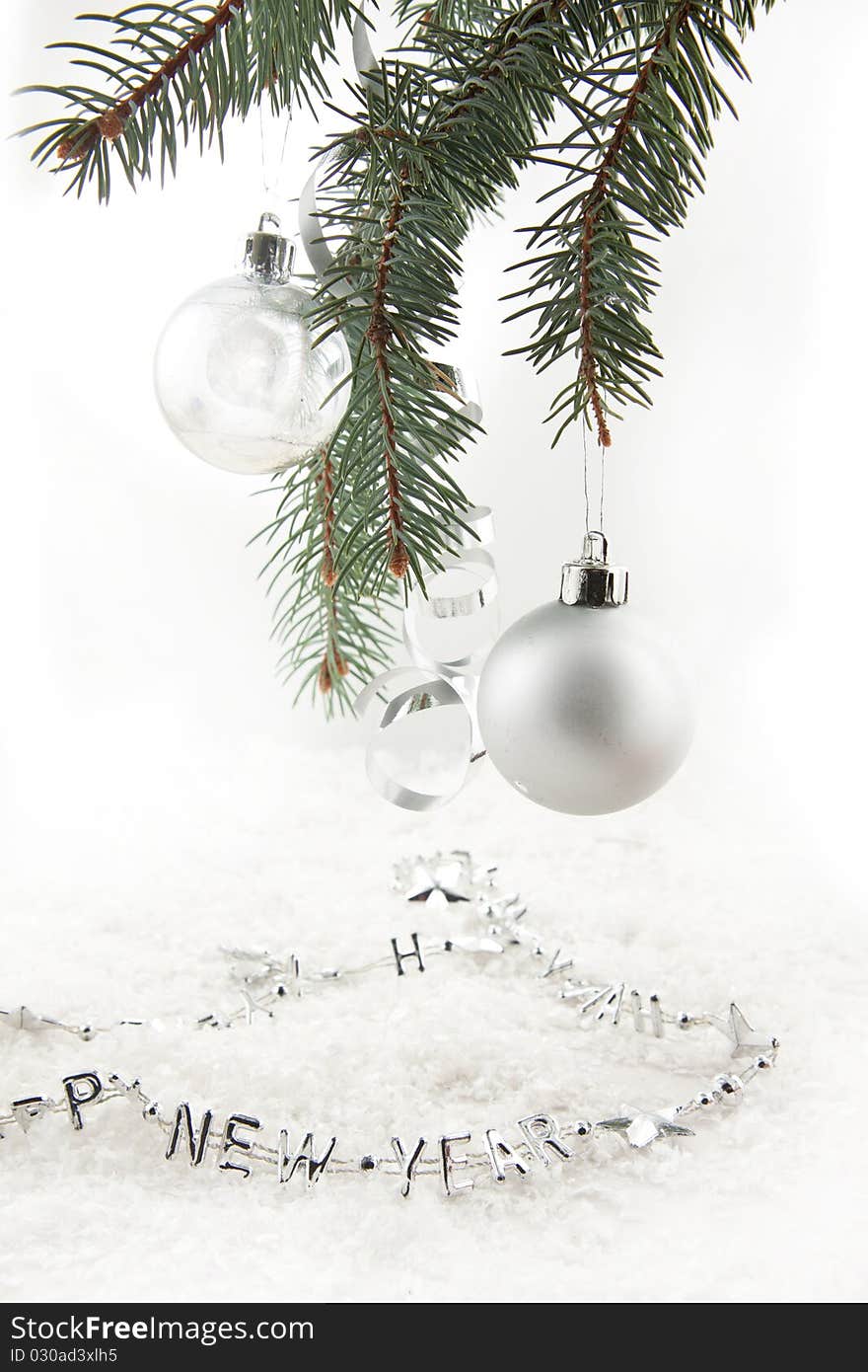 Silver christmas balls with on the christmas tree on a white background