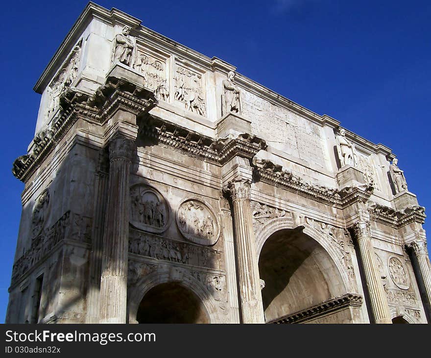 The arch of constantine next to the coliseum in rome. The arch of constantine next to the coliseum in rome