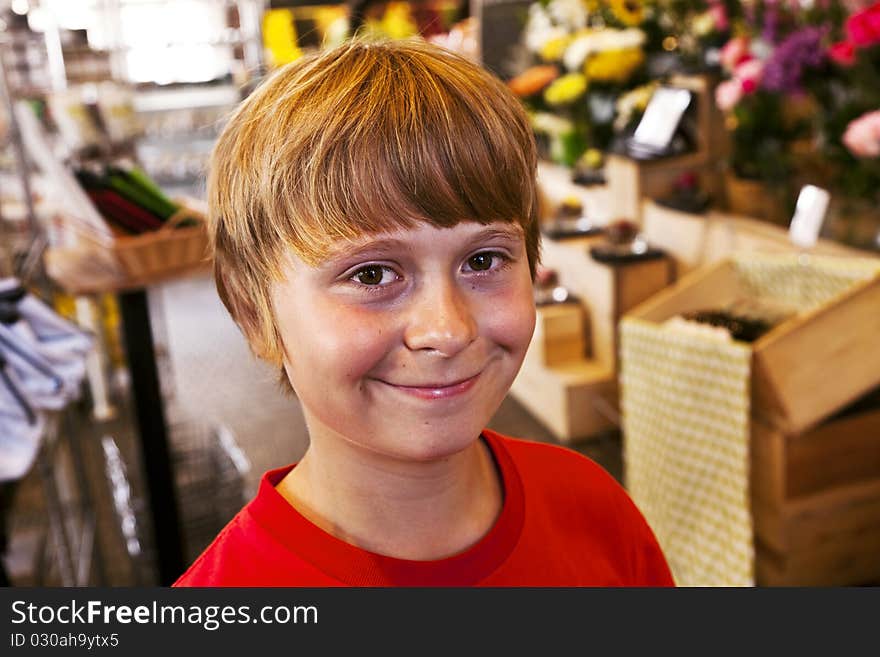 Young Boy Smiles In A Shop