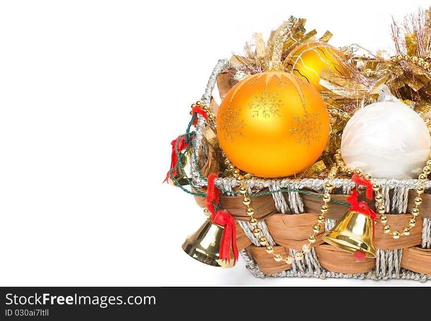 New Year's decoration in a wooden basket with hand bells. New Year's decoration in a wooden basket with hand bells