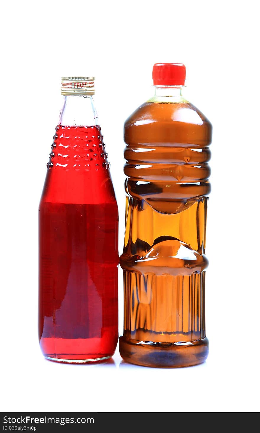 Juice and oil bottles isolated on white background.