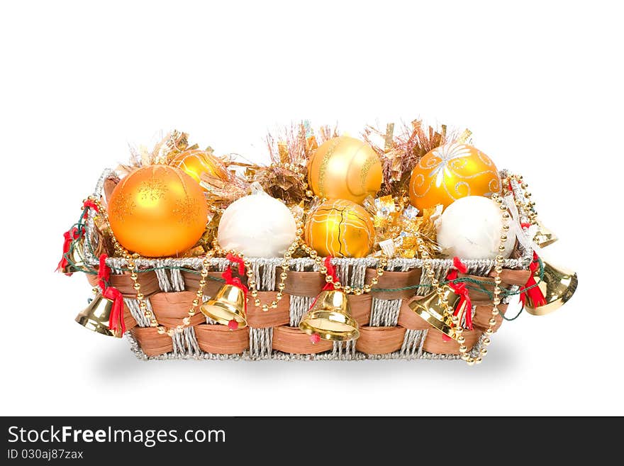 New Year's decoration in a wooden basket with hand bells. New Year's decoration in a wooden basket with hand bells