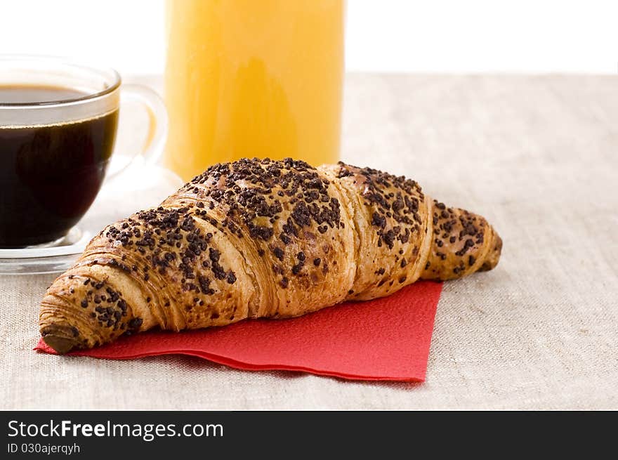 Coffee, juice and croissant with chocolate. Coffee, juice and croissant with chocolate