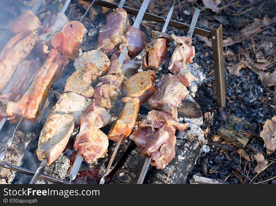 Peaces of meat on skewers and they are fried like stringed on hot coals. Peaces of meat on skewers and they are fried like stringed on hot coals