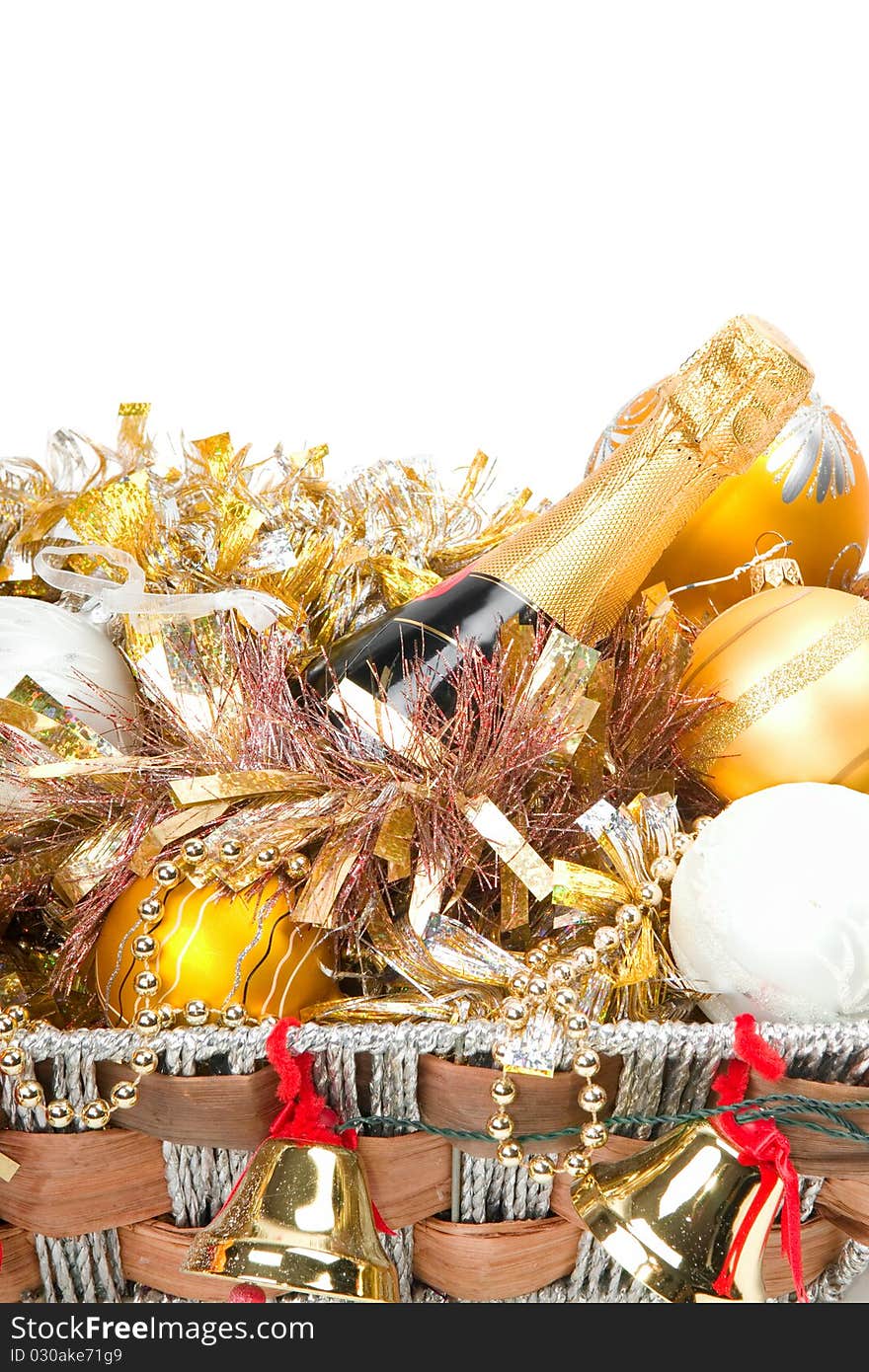 New Year's decoration in a wooden basket with hand bells. New Year's decoration in a wooden basket with hand bells