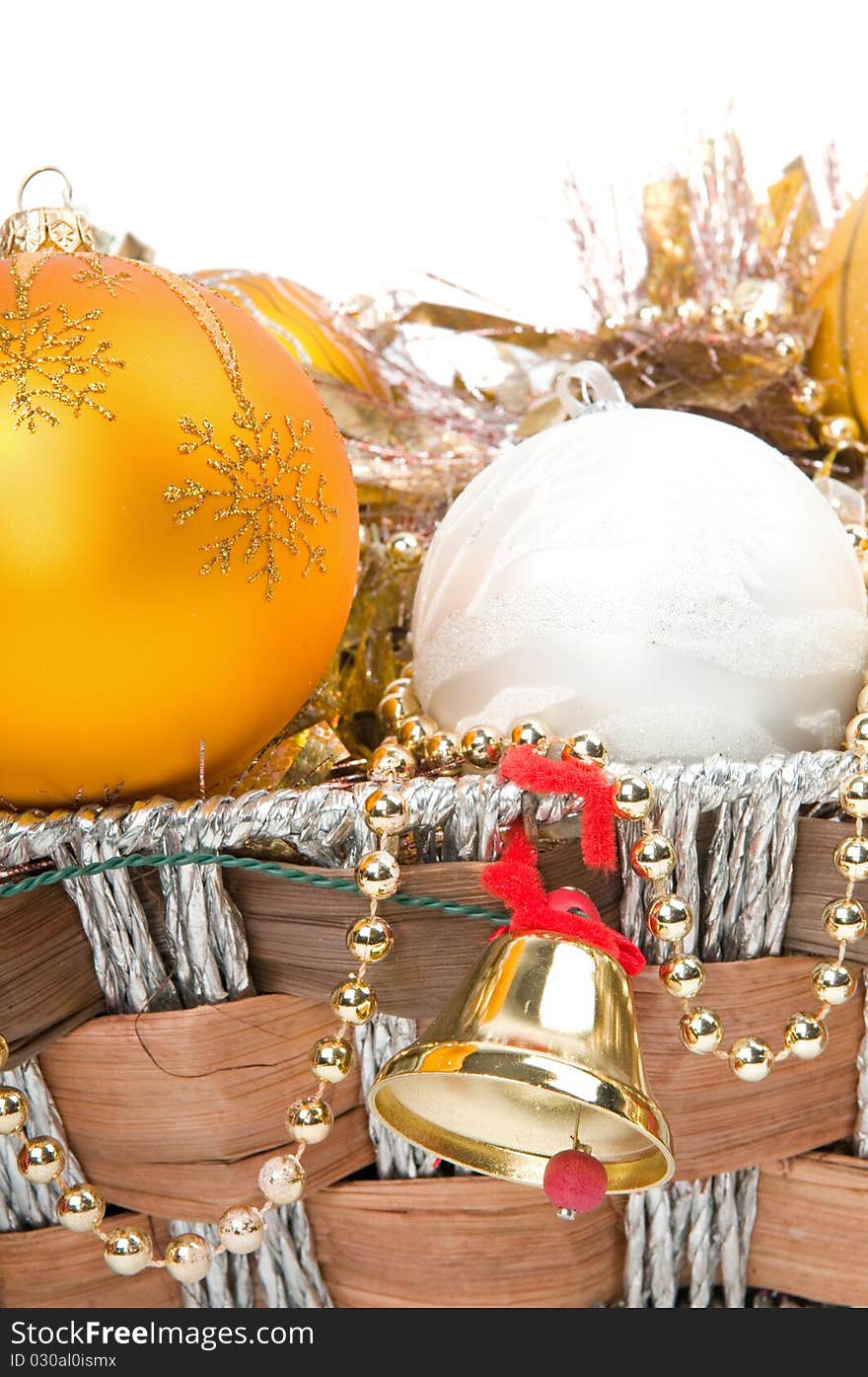 New Year's decoration in a wooden basket with hand bells. New Year's decoration in a wooden basket with hand bells