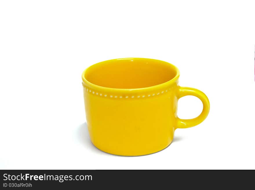 Yellow ceramic cup isolated on white background. Yellow ceramic cup isolated on white background.