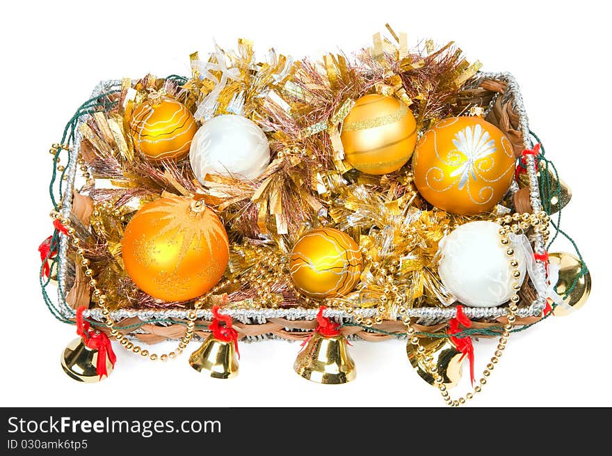 New Year's decoration in a wooden basket with hand bells. New Year's decoration in a wooden basket with hand bells